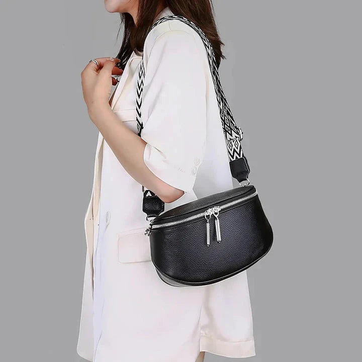 High-quality genuine leather tote bag for women, featuring a beige body with a colorful strap, multiple interior compartments, and a sleek, elegant design.