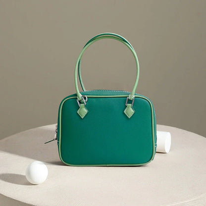 Leather Mini Shoulder Bag in Pink, featuring a compact square shape and crossbody design for versatile everyday use