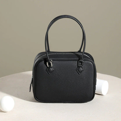 Leather Mini Shoulder Bag in Pink, featuring a compact square shape and crossbody design for versatile everyday use