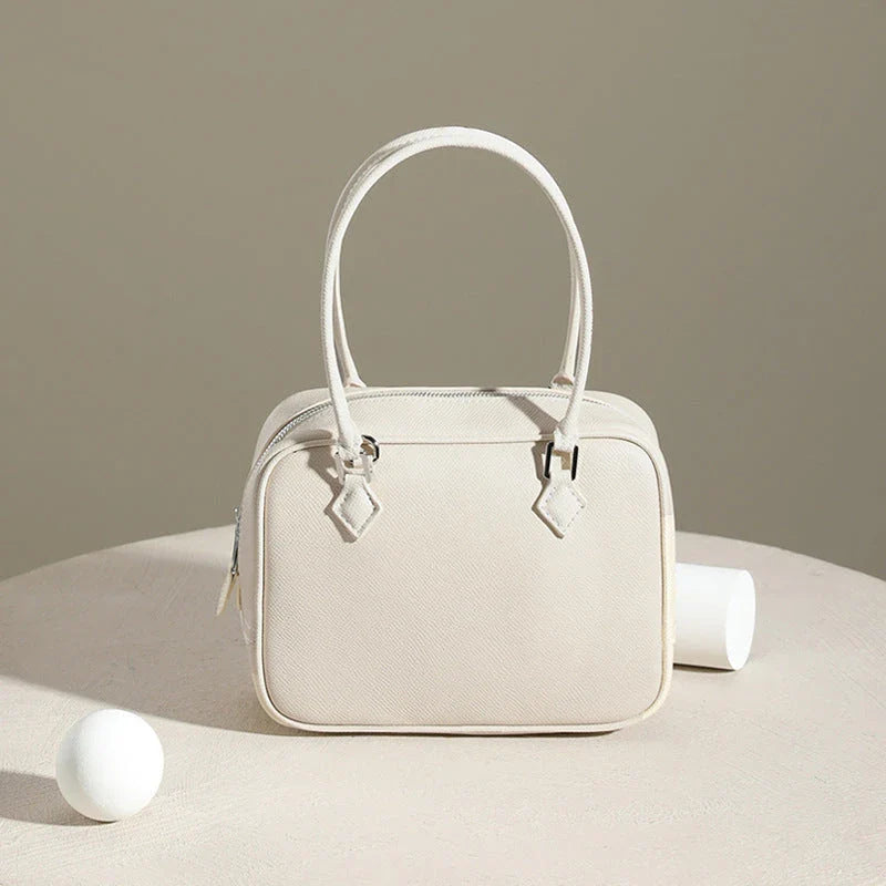 Leather Mini Shoulder Bag in Pink, featuring a compact square shape and crossbody design for versatile everyday use