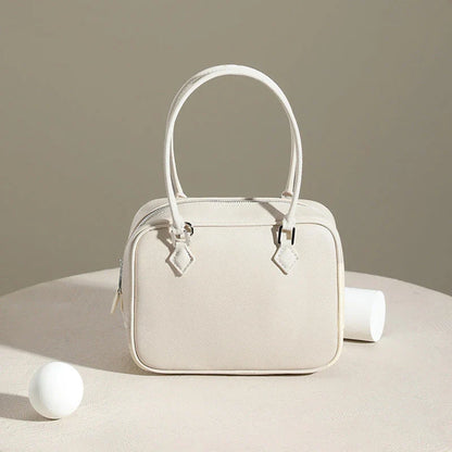 Leather Mini Shoulder Bag in Pink, featuring a compact square shape and crossbody design for versatile everyday use