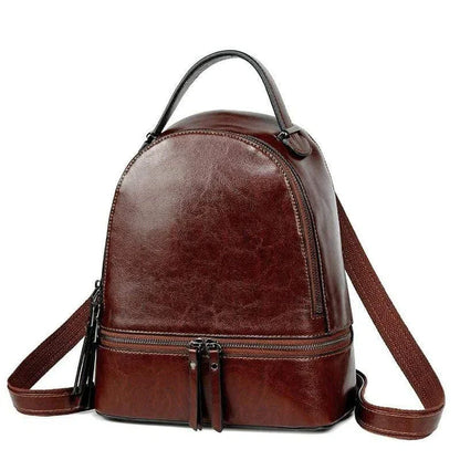 Fashionable leather backpack with cowhide material, multiple pockets, and stylish design elements