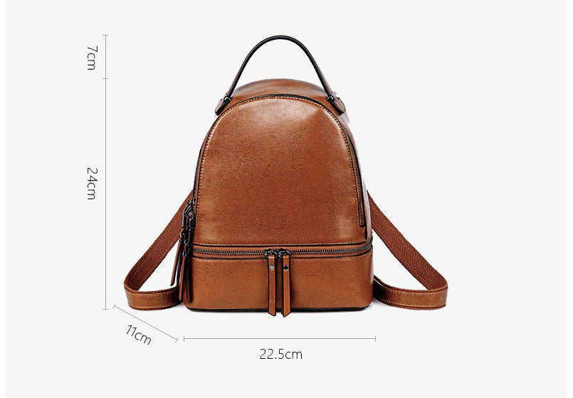 Fashionable leather backpack with cowhide material, multiple pockets, and stylish design elements