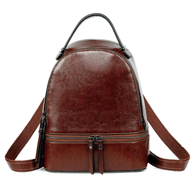 Fashionable leather backpack with cowhide material, multiple pockets, and stylish design elements