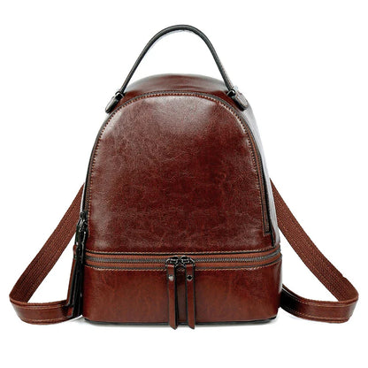Fashionable leather backpack with cowhide material, multiple pockets, and stylish design elements