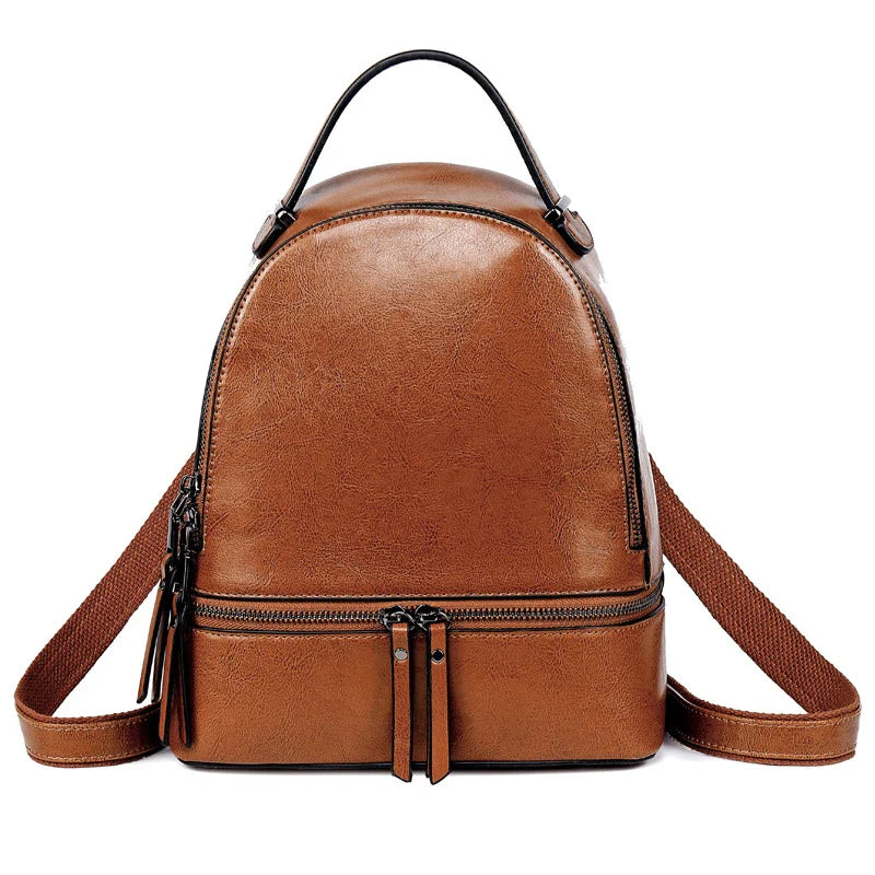 Fashionable leather backpack with cowhide material, multiple pockets, and stylish design elements