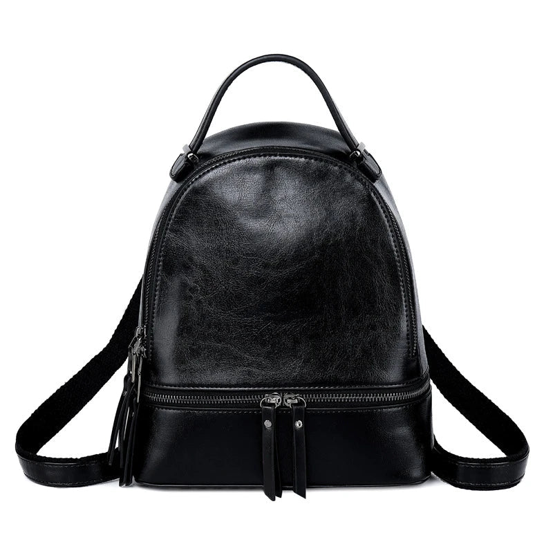 Fashionable leather backpack with cowhide material, multiple pockets, and stylish design elements