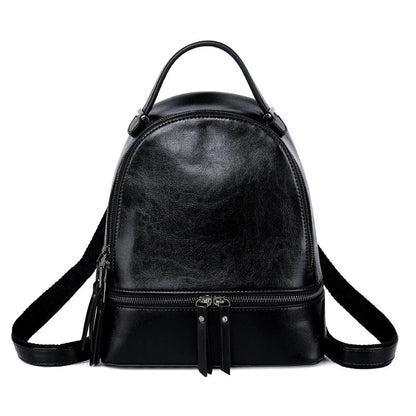 Fashionable leather backpack with cowhide material, multiple pockets, and stylish design elements