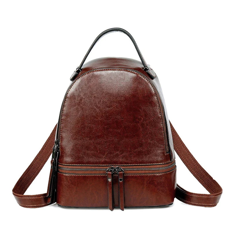 Fashionable leather backpack with cowhide material, multiple pockets, and stylish design elements