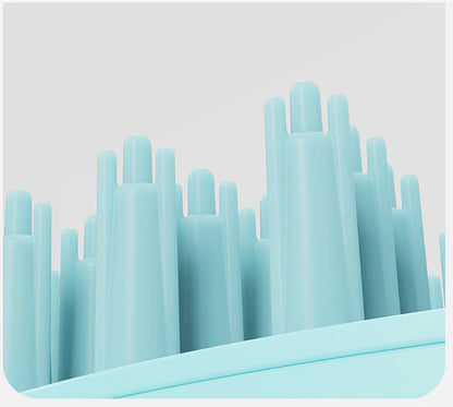 A green pet bath brush designed to provide a relaxing massage experience for dogs during bath time.