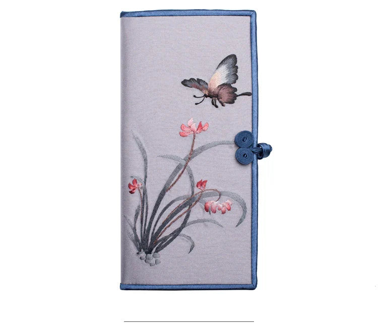 Elegant hand-embroidered long wallet in various colors, featuring a sleek buckle design and ample storage space