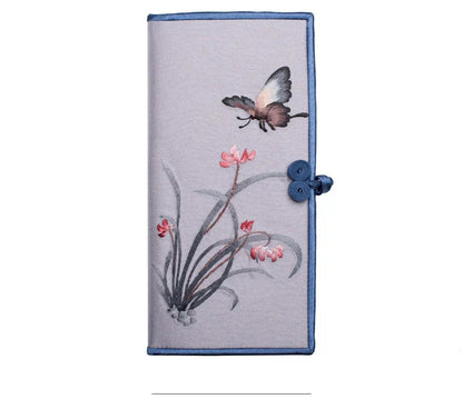 Elegant hand-embroidered long wallet in various colors, featuring a sleek buckle design and ample storage space