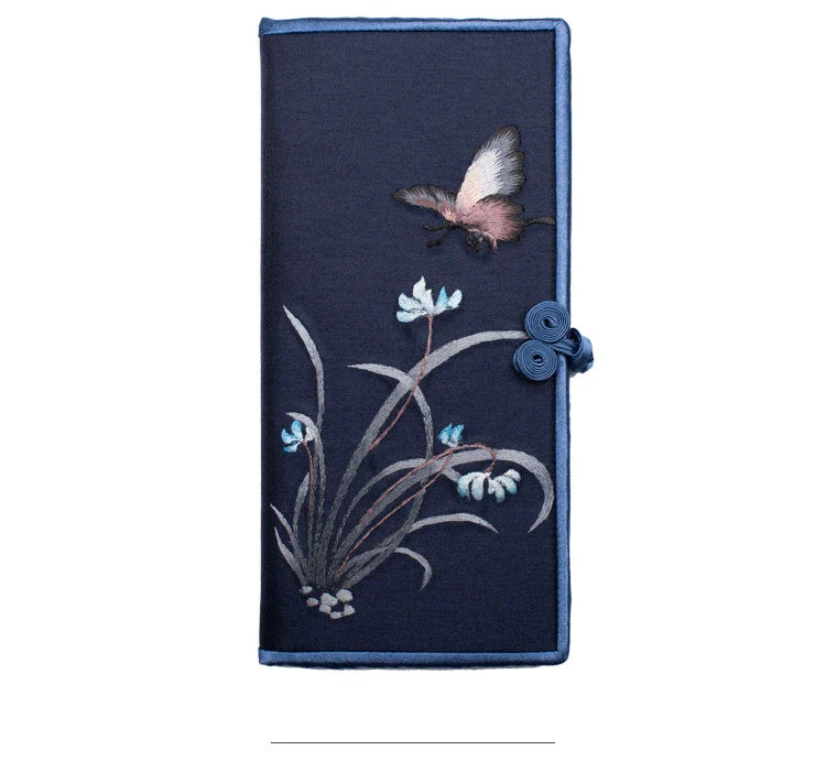 Elegant hand-embroidered long wallet in various colors, featuring a sleek buckle design and ample storage space