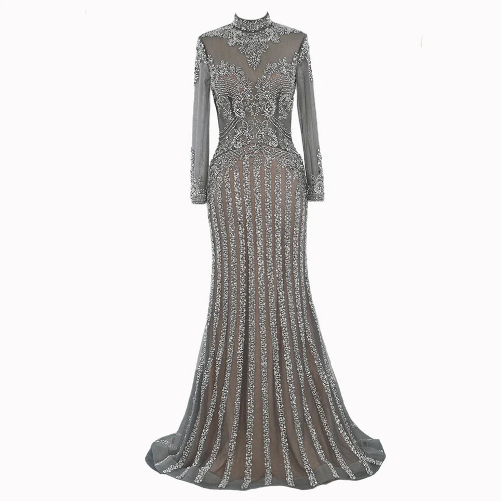 A long sleeve fishtail slim dress with a high waist, zipper closure, and Austrian diamond accents for a sophisticated and elegant look.