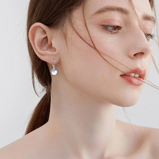 Elegant 925 sterling silver earrings featuring genuine moonstone drops for a timeless and enchanting look