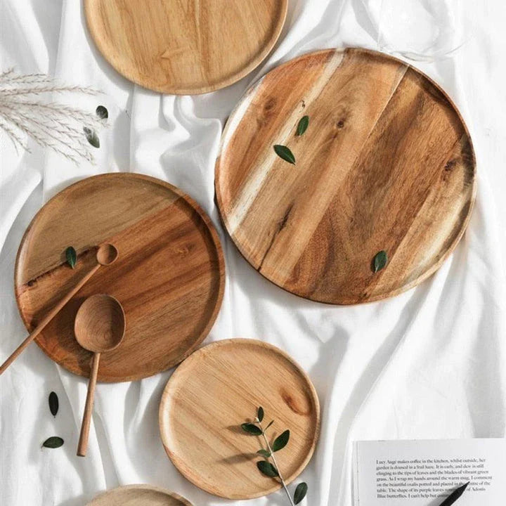 A natural wooden round tray with a sleek, versatile design that complements any home decor.
