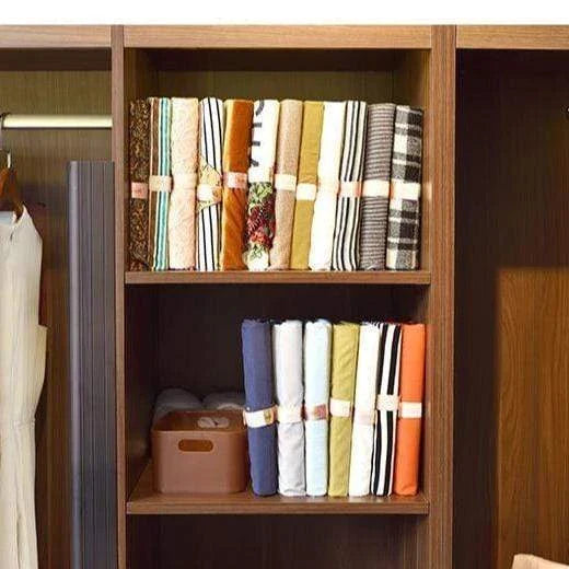 Dress Book - Space-Saving Clothes Folder Organizer with pink and gold color options, neatly organizing and storing clothes in a compact, wrinkle-free manner