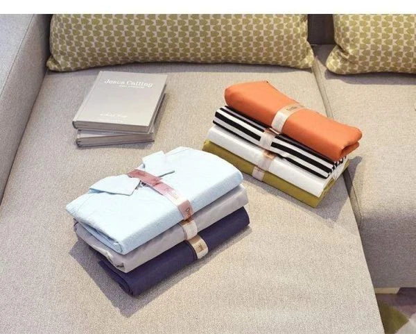 Dress Book - Space-Saving Clothes Folder Organizer with pink and gold color options, neatly organizing and storing clothes in a compact, wrinkle-free manner