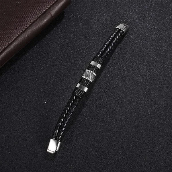 A stylish black braid woven leather bracelet with titanium stainless steel accents, perfect for men's fashion and accessorizing.