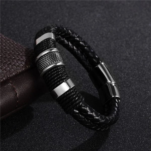 A stylish black braid woven leather bracelet with titanium stainless steel accents, perfect for men's fashion and accessorizing.