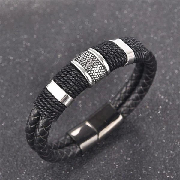 A stylish black braid woven leather bracelet with titanium stainless steel accents, perfect for men's fashion and accessorizing.