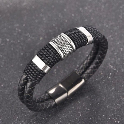 A stylish black braid woven leather bracelet with titanium stainless steel accents, perfect for men's fashion and accessorizing.