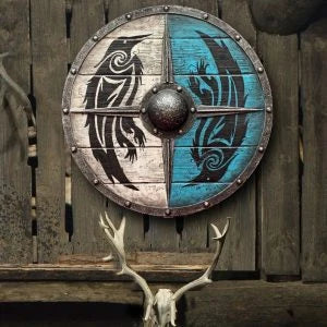Eivor Valhalla Raven War Pattern Viking Shield - Authentic battle-worn design with striking raven motif, tooled Celtic knots, and forged iron spikes