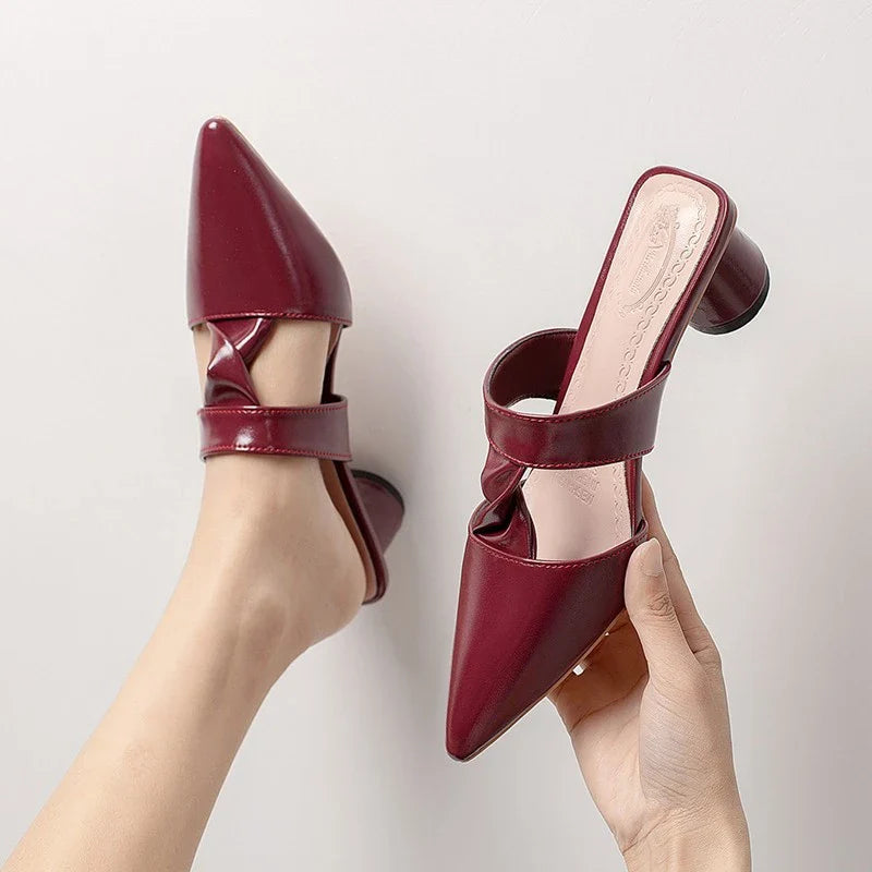 Stylish, pointed-toe sandals with a thick, red heel and PU upper for a fashionable, comfortable look.