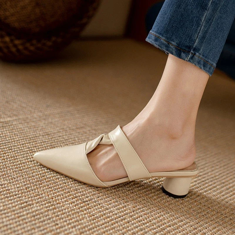 Stylish, pointed-toe sandals with a thick, red heel and PU upper for a fashionable, comfortable look.