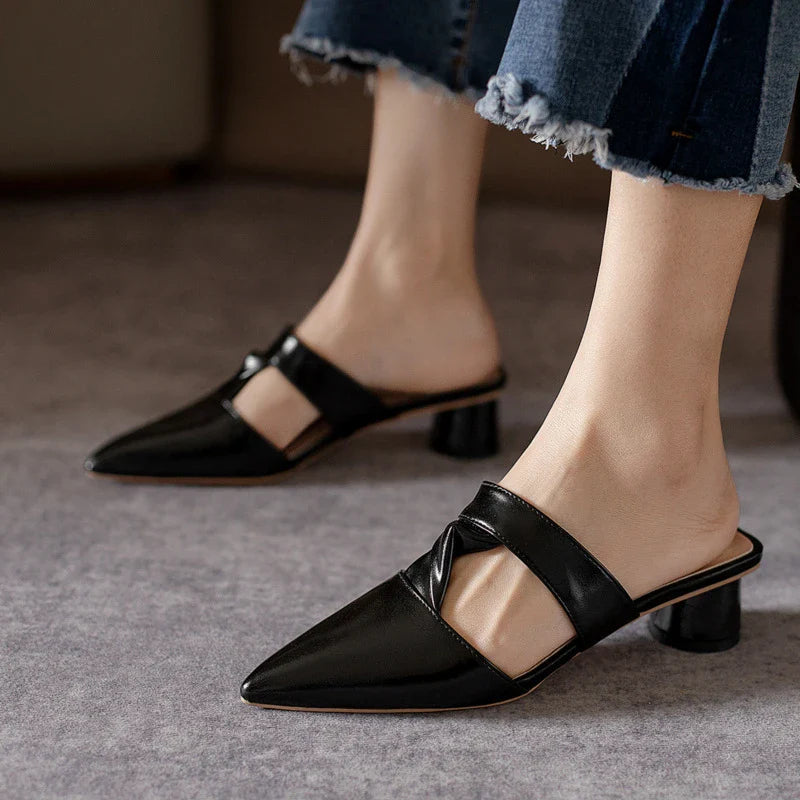 Stylish, pointed-toe sandals with a thick, red heel and PU upper for a fashionable, comfortable look.