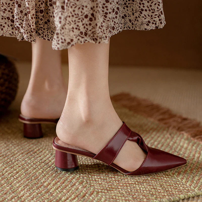 Stylish, pointed-toe sandals with a thick, red heel and PU upper for a fashionable, comfortable look.