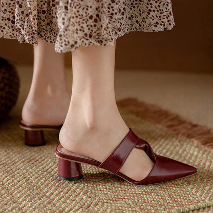 Stylish, pointed-toe sandals with a thick, red heel and PU upper for a fashionable, comfortable look.