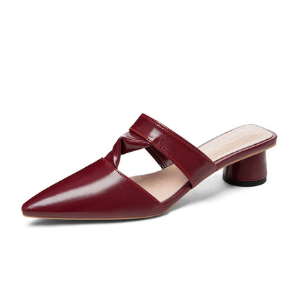 Stylish, pointed-toe sandals with a thick, red heel and PU upper for a fashionable, comfortable look.