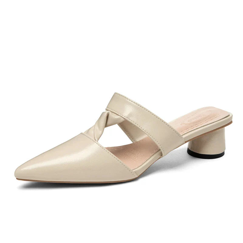 Stylish, pointed-toe sandals with a thick, red heel and PU upper for a fashionable, comfortable look.