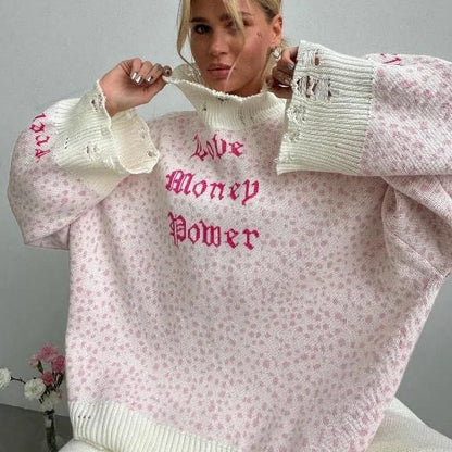 A cozy and stylish embroidered patchwork sweater in a vibrant pink color, perfect for autumn and winter wear.