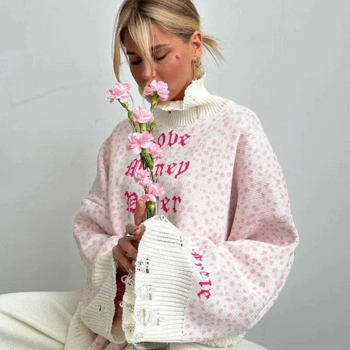 A cozy and stylish embroidered patchwork sweater in a vibrant pink color, perfect for autumn and winter wear.