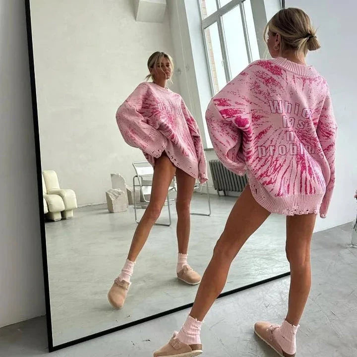 A cozy and stylish embroidered patchwork sweater in a vibrant pink color, perfect for autumn and winter wear.