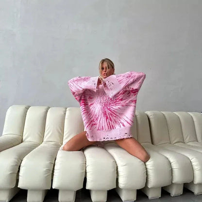 A cozy and stylish embroidered patchwork sweater in a vibrant pink color, perfect for autumn and winter wear.