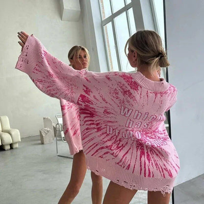 A cozy and stylish embroidered patchwork sweater in a vibrant pink color, perfect for autumn and winter wear.