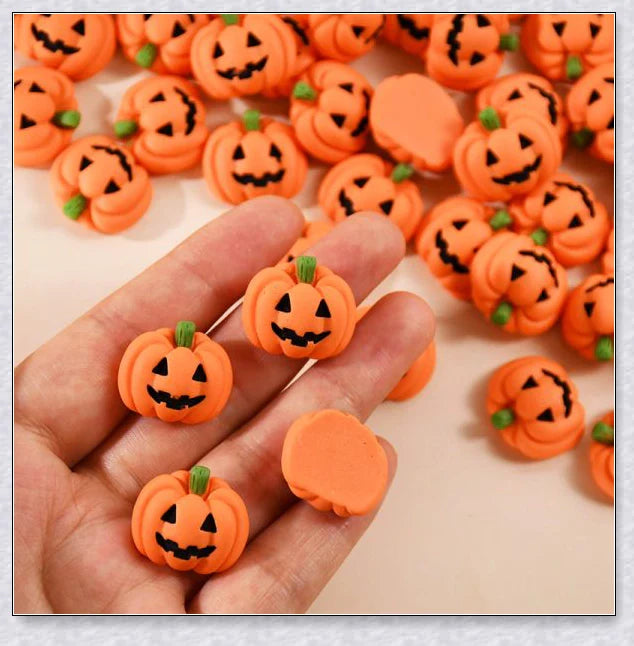 Minkin's resin flat-backed mini Halloween pumpkin miniatures in a variety of vibrant colors, perfect for DIY crafts and decorations