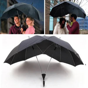 Two people sharing an umbrella, staying dry and close together in the rain