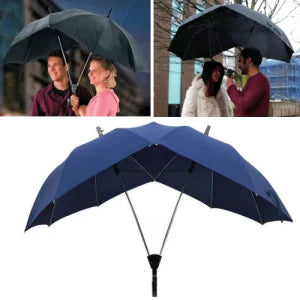 Two people sharing an umbrella, staying dry and close together in the rain