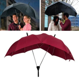 Two people sharing an umbrella, staying dry and close together in the rain