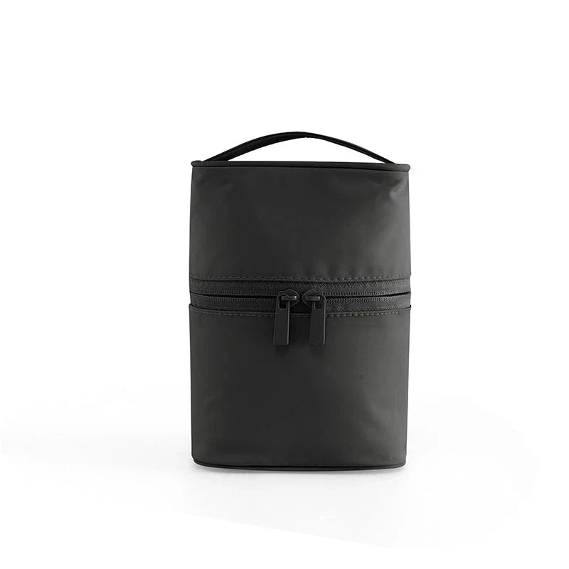 A cylindrical nylon makeup storage bag in a green color, designed for portable and organized beauty on the go.
