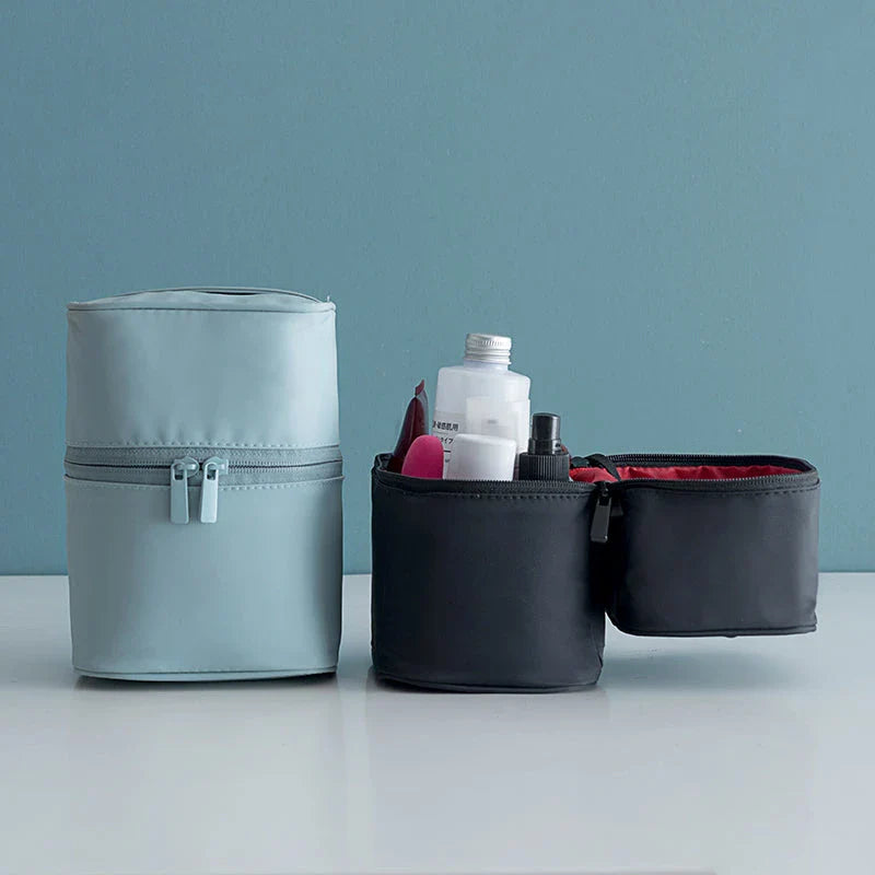A cylindrical nylon makeup storage bag in a green color, designed for portable and organized beauty on the go.