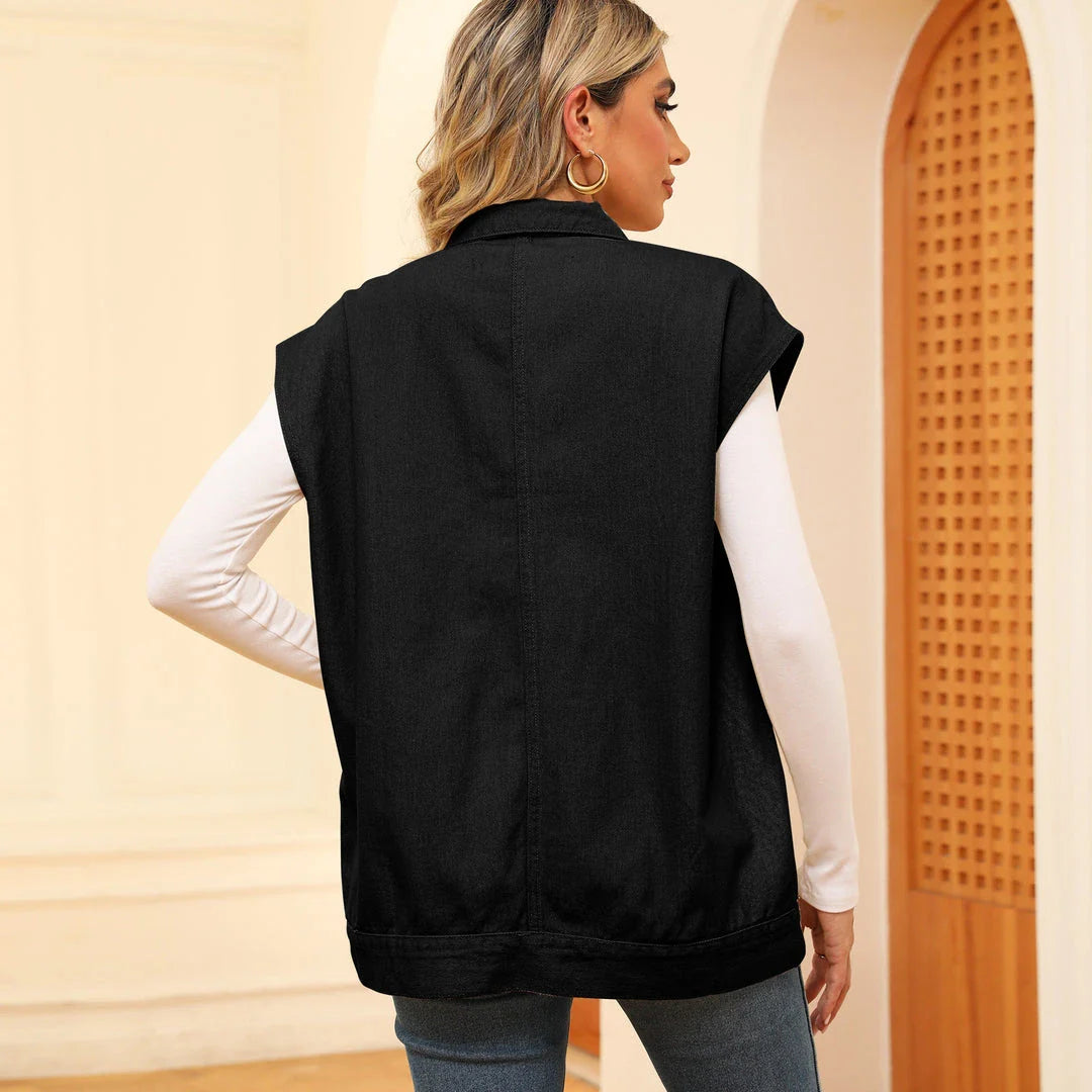 Denim vest with large pockets, sleeveless design, and fashionable silhouette for women's casual and everyday wear