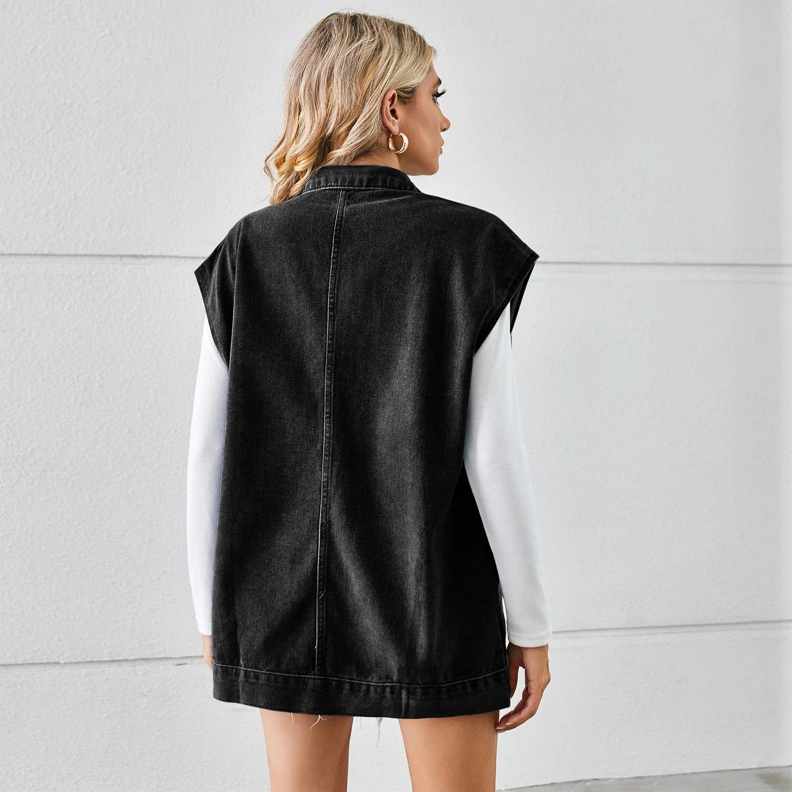 Denim vest with large pockets, sleeveless design, and fashionable silhouette for women's casual and everyday wear