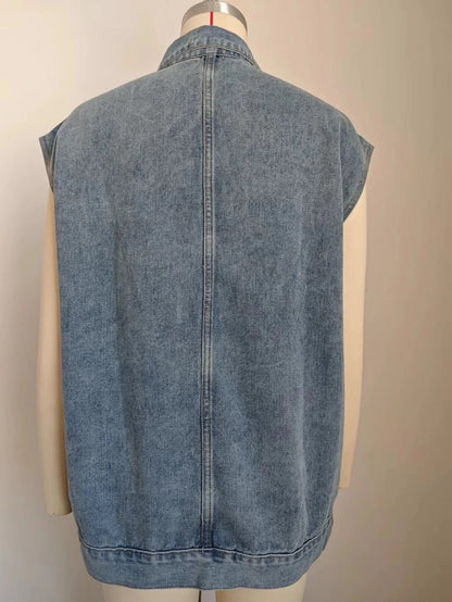 Denim vest with large pockets, sleeveless design, and fashionable silhouette for women's casual and everyday wear