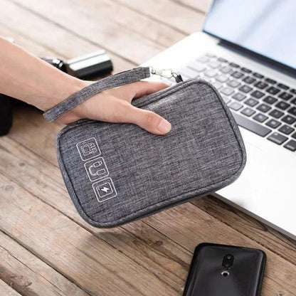 A sleek and compact cable organizer bag made of durable polyester, designed to hold a variety of electronic accessories for travel and home use.