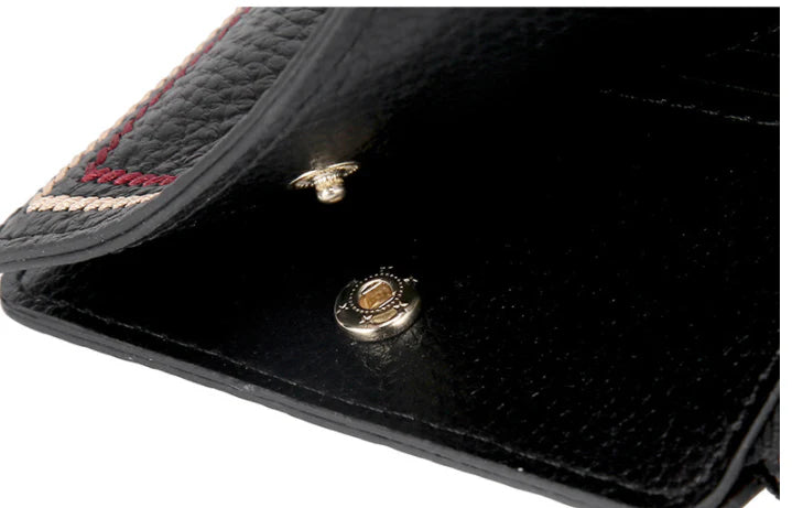 Premium leather wallet with compact, ultra-thin design and magnetic buckle closure for secure and convenient storage of cards, cash, and other essentials.